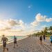 Sunny Miami beach with people jogging in the morning