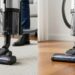 Modern vacuum cleaner transitioning from carpet to hardwood floor showing versatile cleaning capability