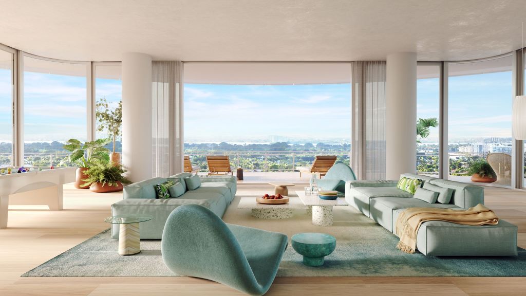 Interior designer arranging décor to match trending Miami home styles