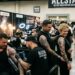 Tattoo artists showcasing intricate black and grey sleeve work at the Allstars Tattoo Convention 2026 in Miami, Florida